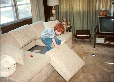 A child wreaking havoc on a couch